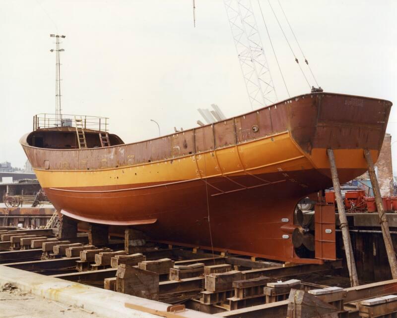 Colour photograph showing the fishing vessel Supreme under construction on the slipway