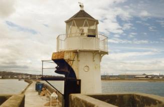 Colour Photograph Showing The Light On The North Pier, Looking Back Towards The City