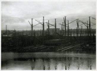 Photograph showing the Lewis shipyard from the River Dee