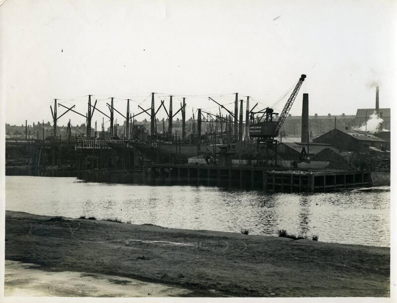 Photograph showing the Lewis shipyard from the River Dee